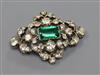 An early 20th century white metal, green and white paste set lozenge shaped brooch, 53mm.                                              