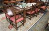 A reproduction oak draw leaf dining table and eight chairs, (two with arms) Table 320cm extended                                       