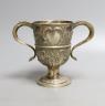 A George III provincial silver two handled pedestal cup, with later embossed decoration, Langlands & Robertson Newcastle, 1794, height 14.7cm, 10.5oz.                                                                      