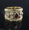 A modern 18ct gold and collet set ruby and diamond dress ring, size P.                                                                 