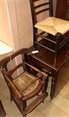 A late Victorian stained beech child's high chair and a child's rush seated ebonised chair                                             