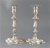 A pair of late Victorian silver candlesticks by William Hutton & Sons Ltd, weighted.                                                   