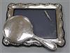 A modern silver mounted photograph frame, a silver mounted hand mirror and a white metal propelling pencil.                            
