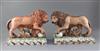 A near pair of Staffordshire pearlware figures of lions, c.1800-10, length 32cm, restorations                                          