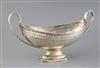 A George III pierced silver two handled boat shaped pedestal fruit bowl, by Henry Chawner, 22oz.                                       