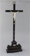 A late 19th century Italian white metal, silvered bronze and ebonised crucifix, 24in.                                                  