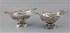 A pair of Victorian pierced silver boat shaped pedestal dishes, maker G.F.?, 28oz.                                                     