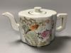 A Chinese famille rose quatre lobed teapot and cover, length 19cm                                                                                                                                                           