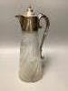 An Edwardian silver mounted cut glass claret jug, James Deakin & Sons Ltd, Sheffield, 1901, height 29.5cm (chipped).                                                                                                        