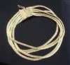 An Italian textured 18ct gold multi strand bracelet, approx. 18.3cm.                                                                   