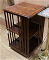 A reproduction walnut revolving bookcase W.50cm                                                                                        