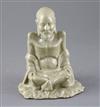 A Chinese celadon glazed figure of Laozi, 18th / 19th century, H.15.5cm, small area of restoration to left knee                        