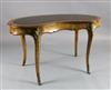 A Victorian crossbanded walnut kidney shaped writing table, W.4ft 3in. D.2ft 3in. H.2ft 6in.                                           