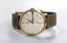 A gentlemen's late 1950's 9ct gold Omega manual wind wristwatch, on Omega leather strap with 9ct gold buckle, cased diameter 34mm, gross weight 30 grams, with Omega box.                                                   