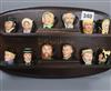 Twelve Royal Doulton Dickens miniature character jugs with Doulton display shelf                                                       