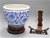 A Chinese blue and white jardiniere and two Chinese hardwood stands                                                                    