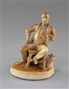 A Doulton Lambeth salt glazed stoneware figure of a seated gentleman, by George Tinworth, 10.5cm                                       