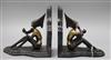 After Lorenzl. A pair of bronzed metal marble bookends height 20cm                                                                     