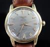 A gentleman's 1950's/1960's 18ct gold Longines Conquest automatic wrist watch,                                                         