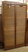 An oak double tambour shutter filing cabinet W.92cm                                                                                    