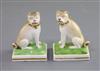 A pair of Derby porcelain figures of seated pug dogs, c.1830, modelled by Edward Keys, H. 8cm                                          