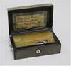 A 19th century bois durci musical snuff box                                                                                            