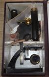 A late Victorian lacquered brass microscope by R + J Beck                                                                              