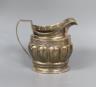 A George III silver cream jug, with lobed body, Soloman Hougham, London, 1799, 10.3cm, 159 grams.                                                                                                                           