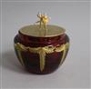 A modern Theo faberge silver gilt lidded ruby glass jar, with ballerinas finial, Birmingham, 2001, height 86mm.                        