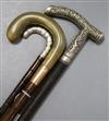 Two silver mounted and handled walking sticks and a horn, 9ct mounted walking stick                                                    