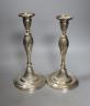 A pair of George III silver candlesticks, with waisted fluted stems, R.S. Sheffield, 1793 & 1796, 22.9cm, weighted (a.f.).                                                                                                  