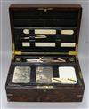 A writing box containing inkwells Length 38cm.                                                                                         