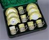 A cased yellow ground porcelain and silver mounted coffee set                                                                          