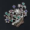 An early 20th century gold and multi gem set guiardinetto (flowers in a basket) brooch, gross 9.9 grams.                               