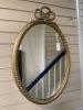 A gilt and composite wall mirror with simulated rope twist frame, width 56cm, height 84cm                                                                                                                                   