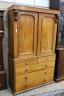 A Victorian satin walnut press cupboard, fitted a pair of doors over two drawers and three long drawers on plinth base, width 124cm, depth 56cm, height 210cm                                                               