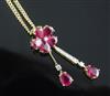 A modern 18ct gold, ruby and diamond set double drop pendant, pendant 36mm.                                                            