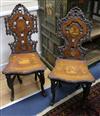 A pair of 19th century Swiss / Black Forest marquetry hall chairs                                                                      