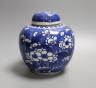 A Chinese blue and white jar and cover, Kangxi mark and of the period, 15cm tall                                                                                                                                            