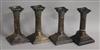 Two pairs of silver corinthian dwarf column candlesticks, tallest 15.5cm.                                                              