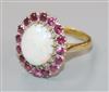 An 18ct gold, white opal and ruby set oval cluster dress ring, size L.                                                                 