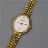 A lady's 9ct gold Longines quartz oval wrist watch, on a 9ct gold bracelet.                                                            