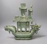 A Chinese hardstone intricately carved model of a boat, with inscription on the flag - 31cm tall                                                                                                                            