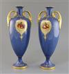 A pair of Royal Worcester two handled vases 33cm.                                                                                      