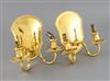 A matched pair of George V silver gilt two branch, two light wall sconces,                                                             