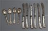 A set of six George V silver pistol handled fruit knives, a set of four unmarked lace back teaspoons.                                  