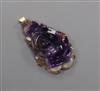 A 18k yellow metal mounted amethyst quartz carved 'rose' pendant, 36mm.                                                                