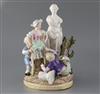 A Meissen group of children picking apples in a garden with a classical statue, late 19th century, H. 26.5cm                           