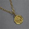 A yellow metal St. Christophers pendant on an 18ct gold chain.                                                                         