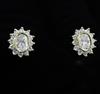 A pair of 18ct gold and oval diamond cluster earrings, 12mm.                                                                           